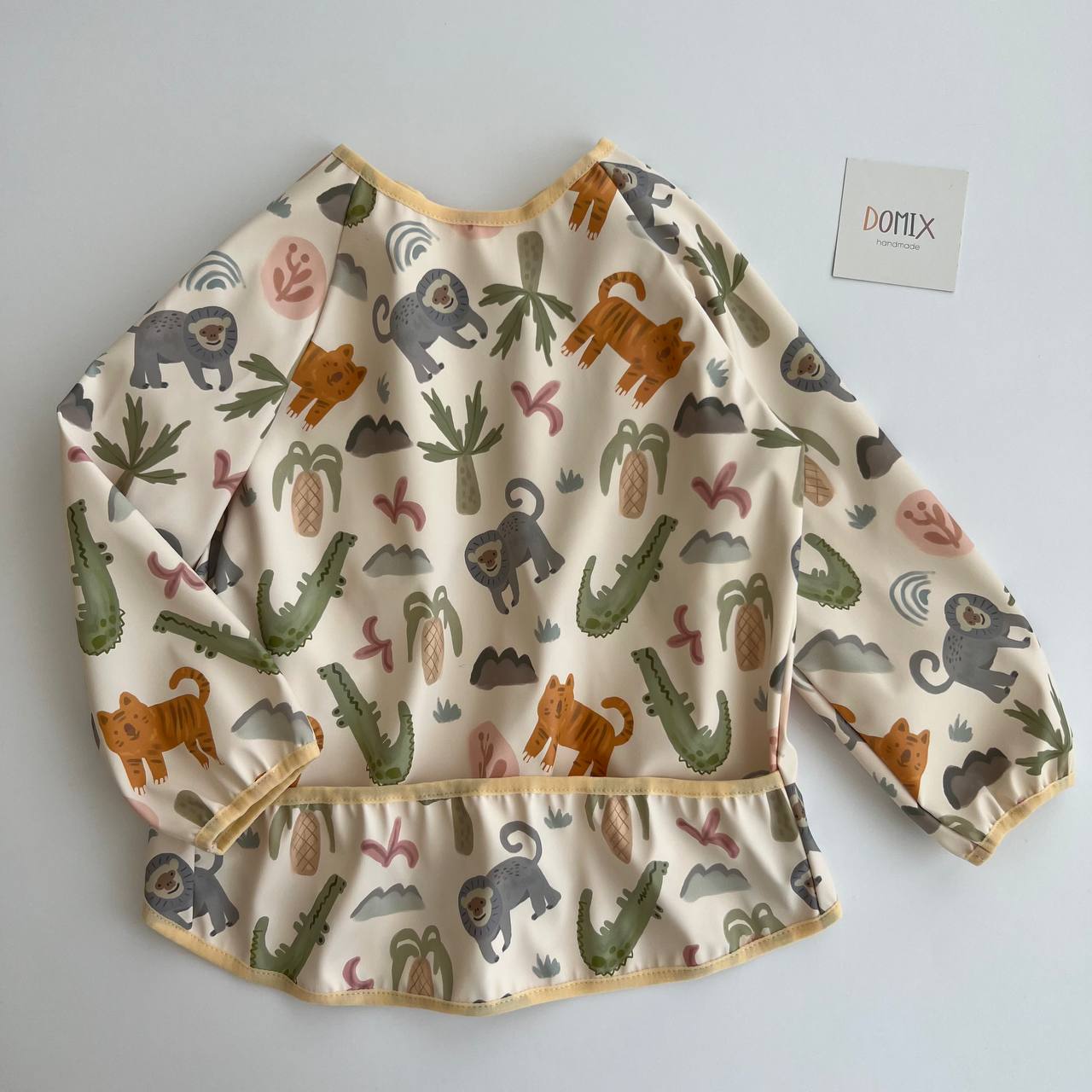 Children's long-sleeve shirt with animal pattern on a light gray background